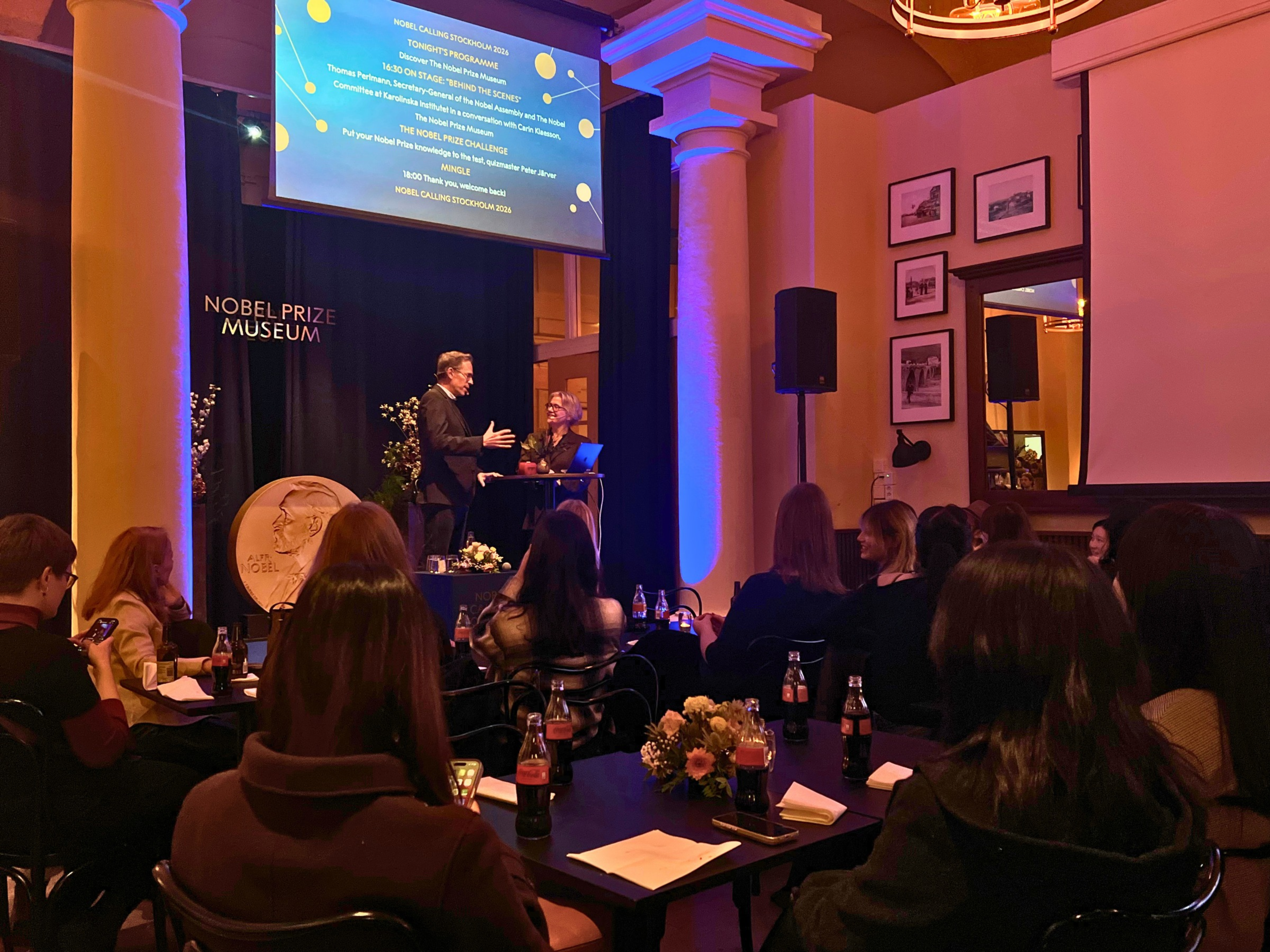 Guests attending a presentation at the Nobel Prize Museum during the Nobel Calling Stockholm 2026 programme.